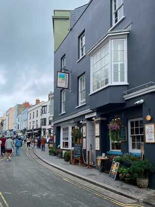 A winding lane with pubs in central Tenby